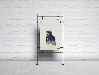 Portrait of woman against building wall