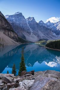 Scenic view of lake with mountain range in background