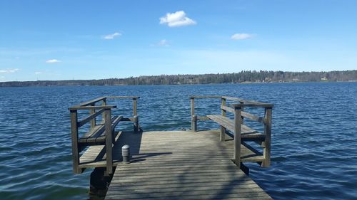 Pier over lake against sky