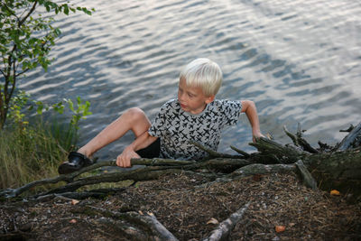 Boy climbing a rock