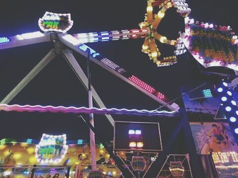 illuminated, low angle view, night, lighting equipment, hanging, decoration, amusement park, built structure, architecture, multi colored, amusement park ride, building exterior, arts culture and entertainment, sky, celebration, tradition, lantern, no people, cultures, outdoors