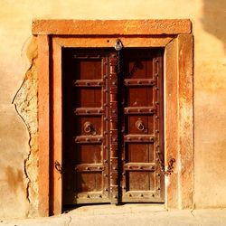 Closed wooden door of house