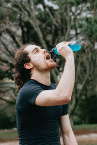 Young woman drinking water