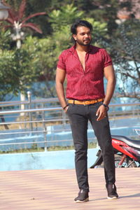 Full length portrait of young man standing outdoors