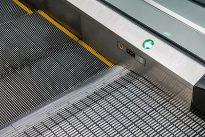 Low angle view of text on escalator