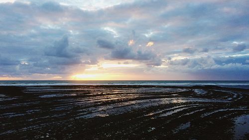 Scenic view of sea against sky at sunset