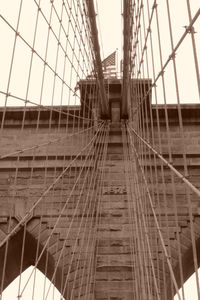 Bridge in city against clear sky