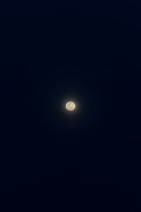 Low angle view of moon against sky at night