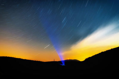 Scenic view of silhouette star field against sky at night