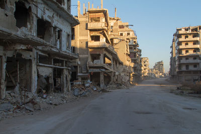 Old buildings in city against clear sky