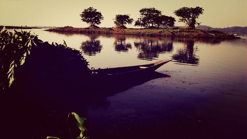 Scenic view of lake at sunset