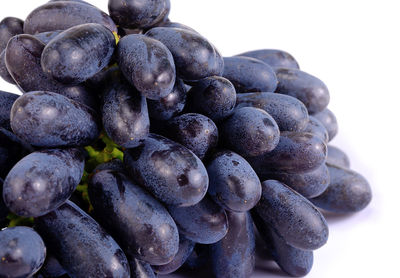 Close-up of grapes against white background