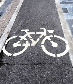 High angle view of bicycle lane sign on road