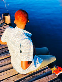 Rear view of man looking at sea