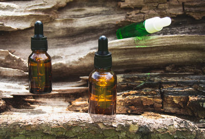 Set of glass bottles for cosmetic product. natural cosmetics concept from wild plants. 