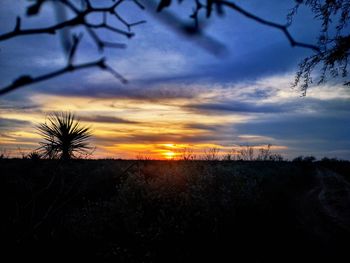 Scenic view of silhouette landscape against sky during sunset