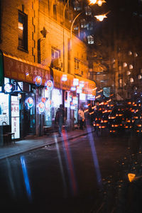 Illuminated city street at night