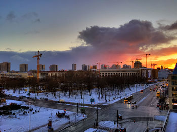 Cityscape against sky during sunset