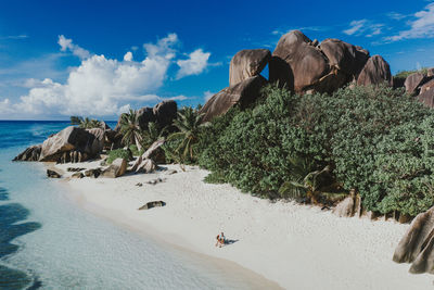 Panoramic view of rocks on beach against sky