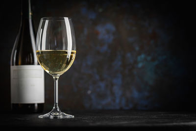 Close-up of wineglass on table