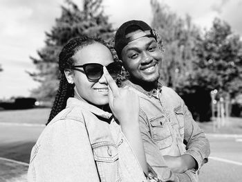 Portrait of smiling couple standing at park