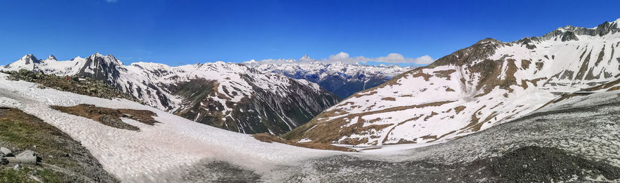 Ultra wide panorama from the nufenenpass with snowy mountains