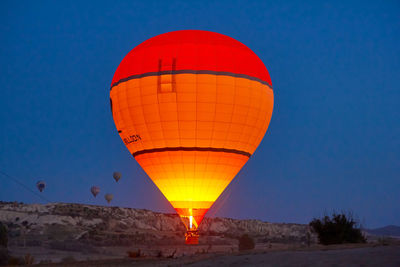 Low angle view of hot air balloon against blue sky