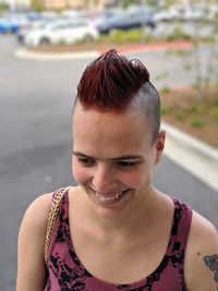 Close-up of smiling young woman looking away