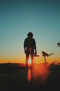 Man against sky during sunset