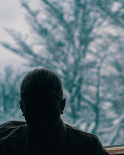Close-up portrait of man standing in winter
