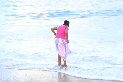 Woman standing on shore