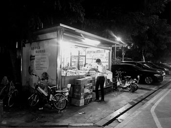 People on illuminated city at night