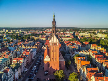 High angle view of city buildings against sky