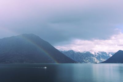 Double rainbow with dramatic clouds across the fjords of kotor bay