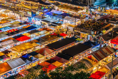 High angle view of illuminated carousel at night