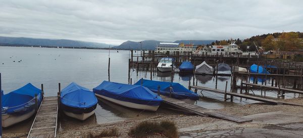 Boats moored at harbor