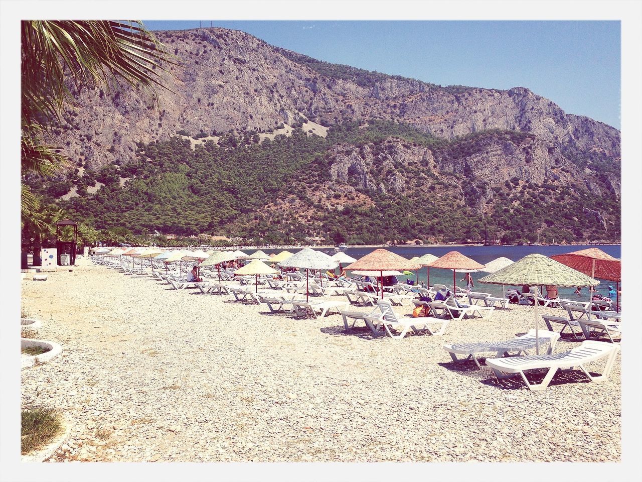 transfer print, auto post production filter, mountain, beach, sand, tranquil scene, tranquility, nature, scenics, day, sky, clear sky, shore, beauty in nature, landscape, tree, sunlight, outdoors, built structure, incidental people