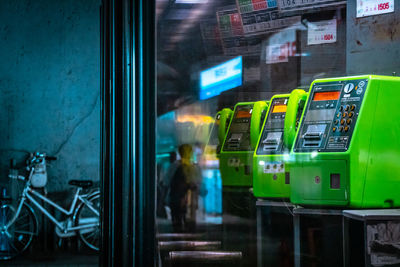 View of illuminated street seen through train window