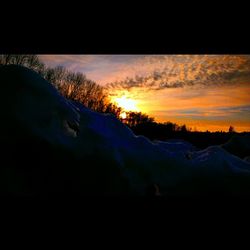 Scenic view of snow covered mountains against sky