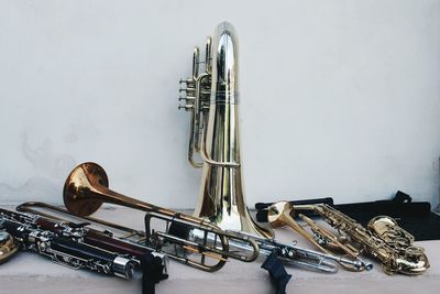 Close-up of wind instruments on table