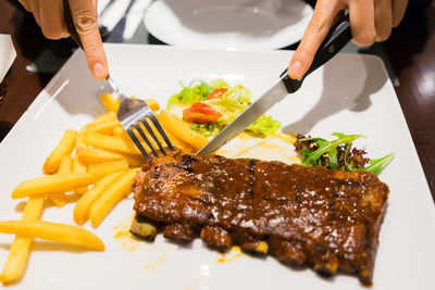 Close-up of man preparing food