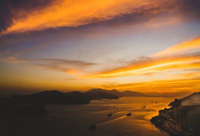 Scenic view of sea against orange sky