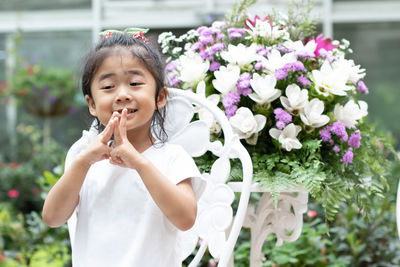 Close-up of girl holding flowers