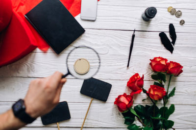 High angle view of red roses on table