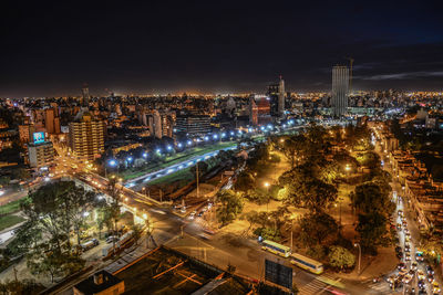 High angle view of illuminated city buildings at night