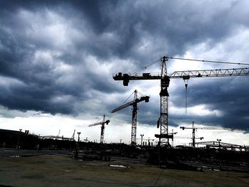 Crane against cloudy sky