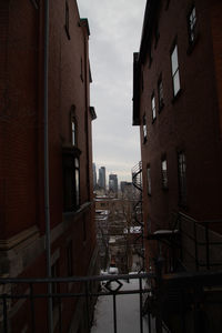 Buildings in city against sky at dusk