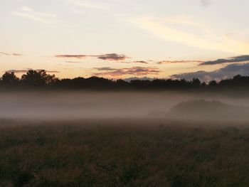 Scenic view of landscape against sky during sunset