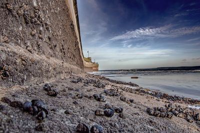 Scenic view of sea against cloudy sky
