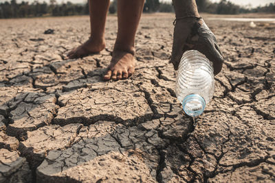 Low section of people standing on mud land